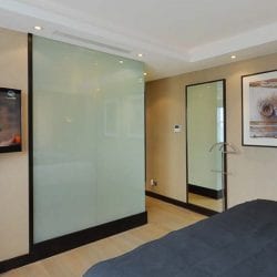 Smart glass shower cubicle in a luxury bedroom